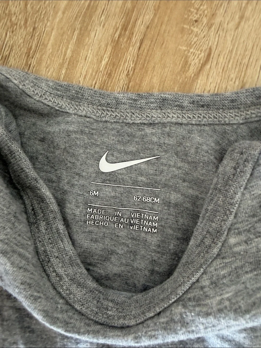 Nike Heather Gray Infant Bodysuit with White Swoosh